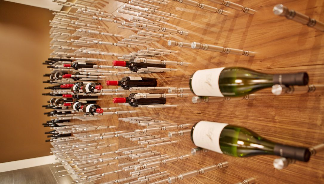 Modern wall wine cellar racking system in a residential home in Los Angeles