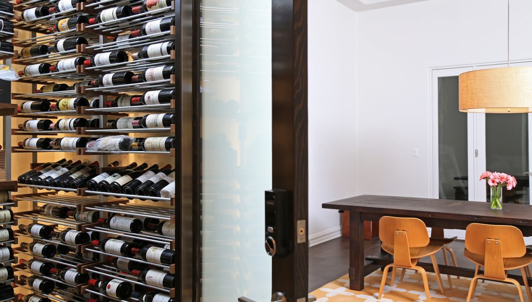 Door opened to traditional wine cellar off the living area of a residential home