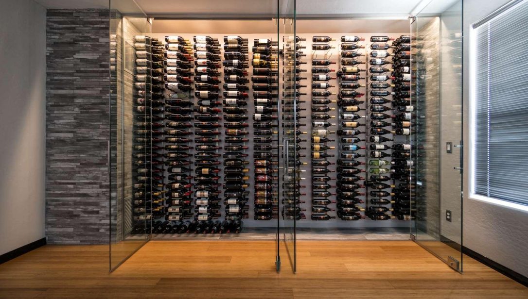 Glass doors opening up to wine wall