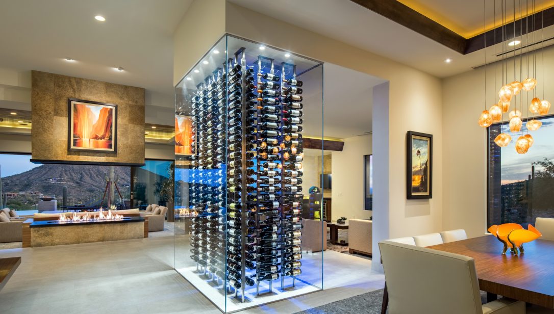 Glass enclosed wine cellar as a centre piece of a living area