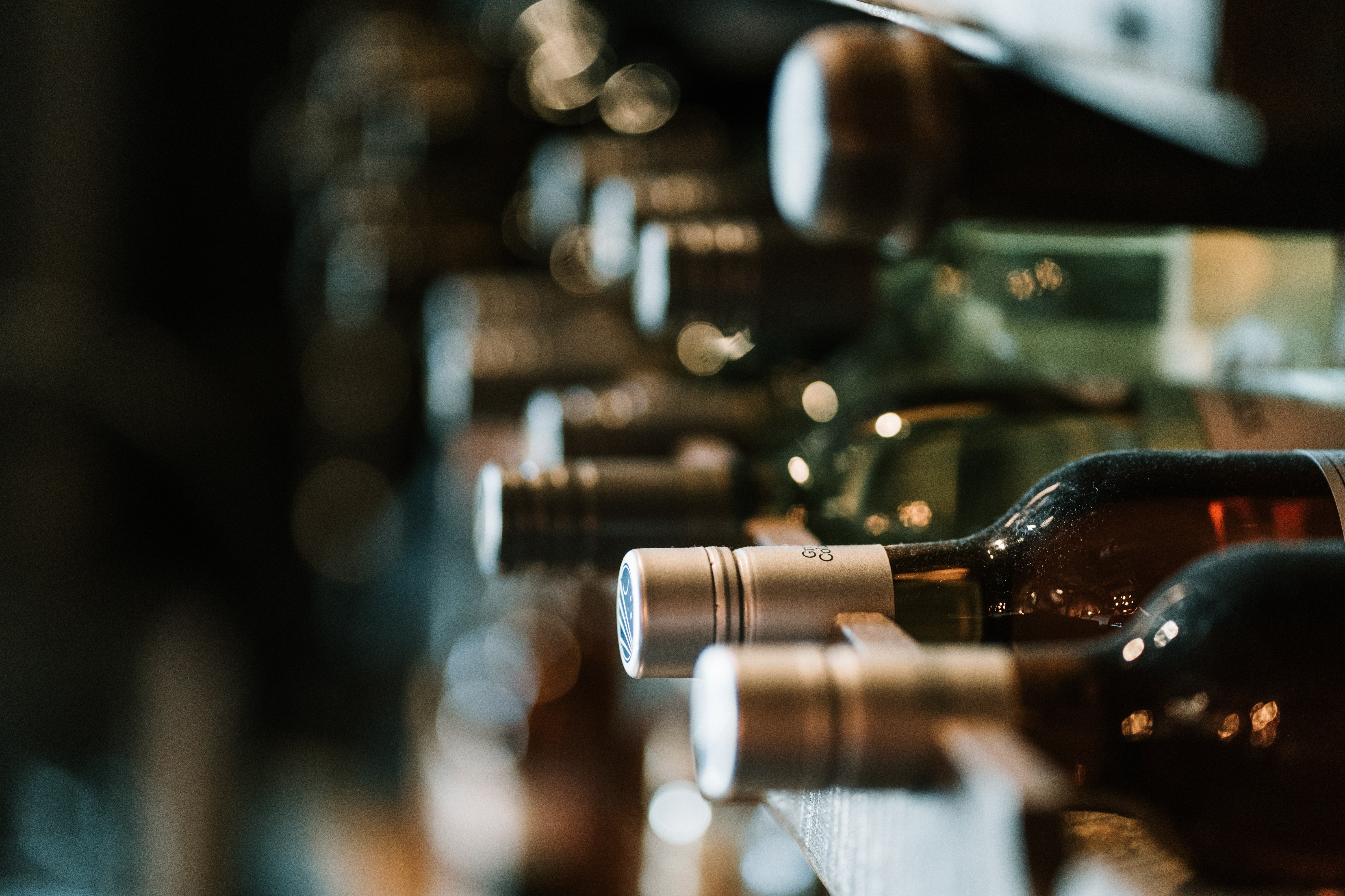 Close up of wine displayed in traditional wine cellar