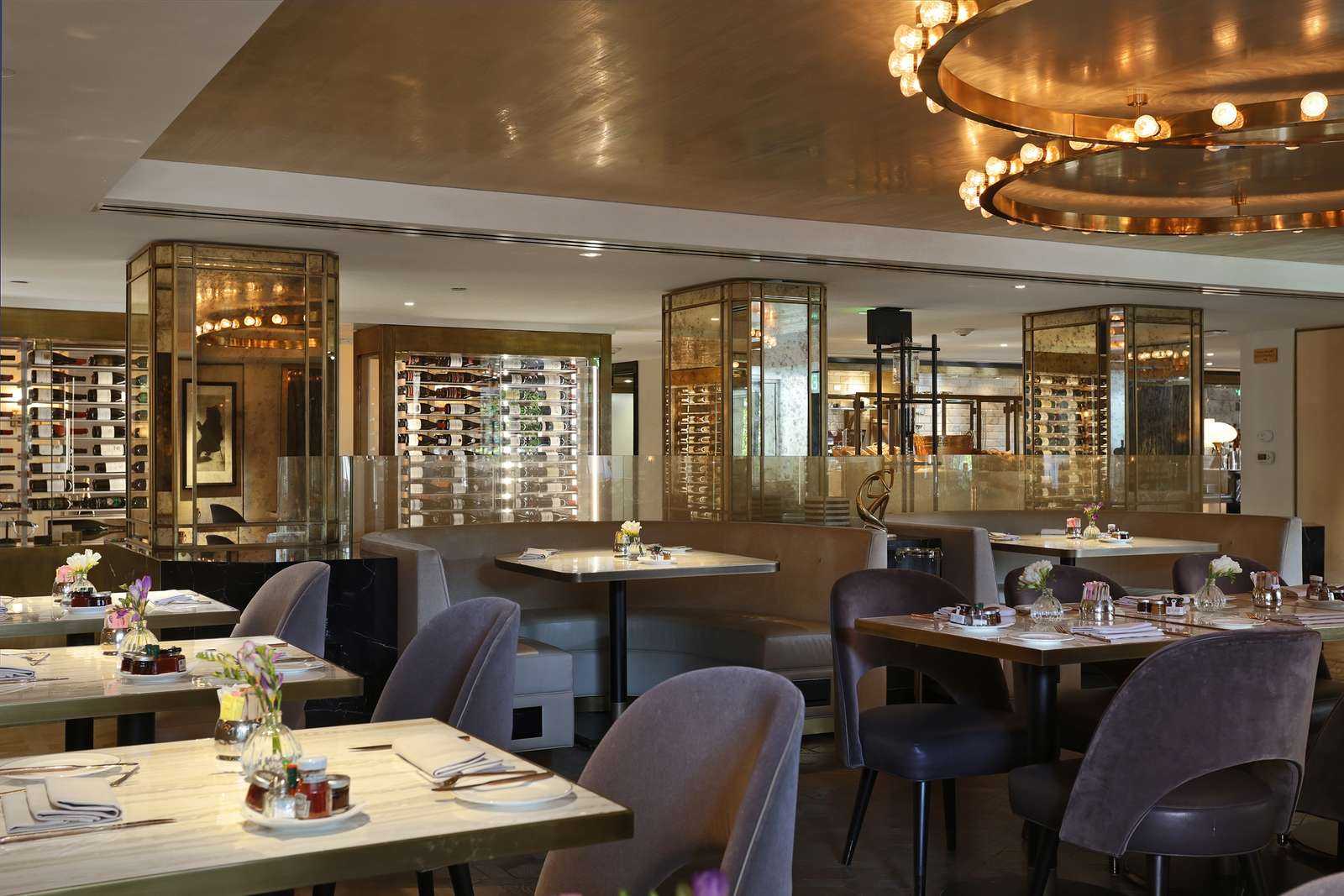 custom wine cellar across back wall in AvecNous restaurant