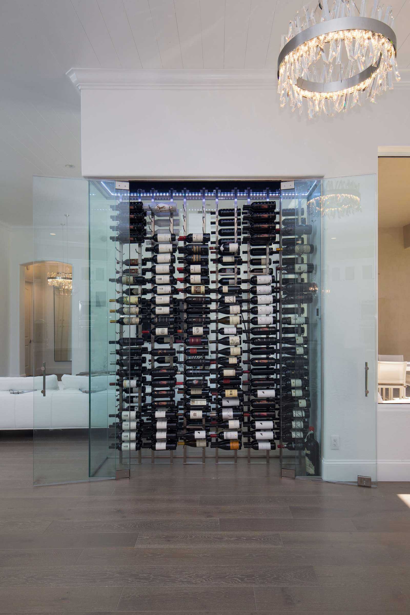 glass enclosed wine cellar in home living area