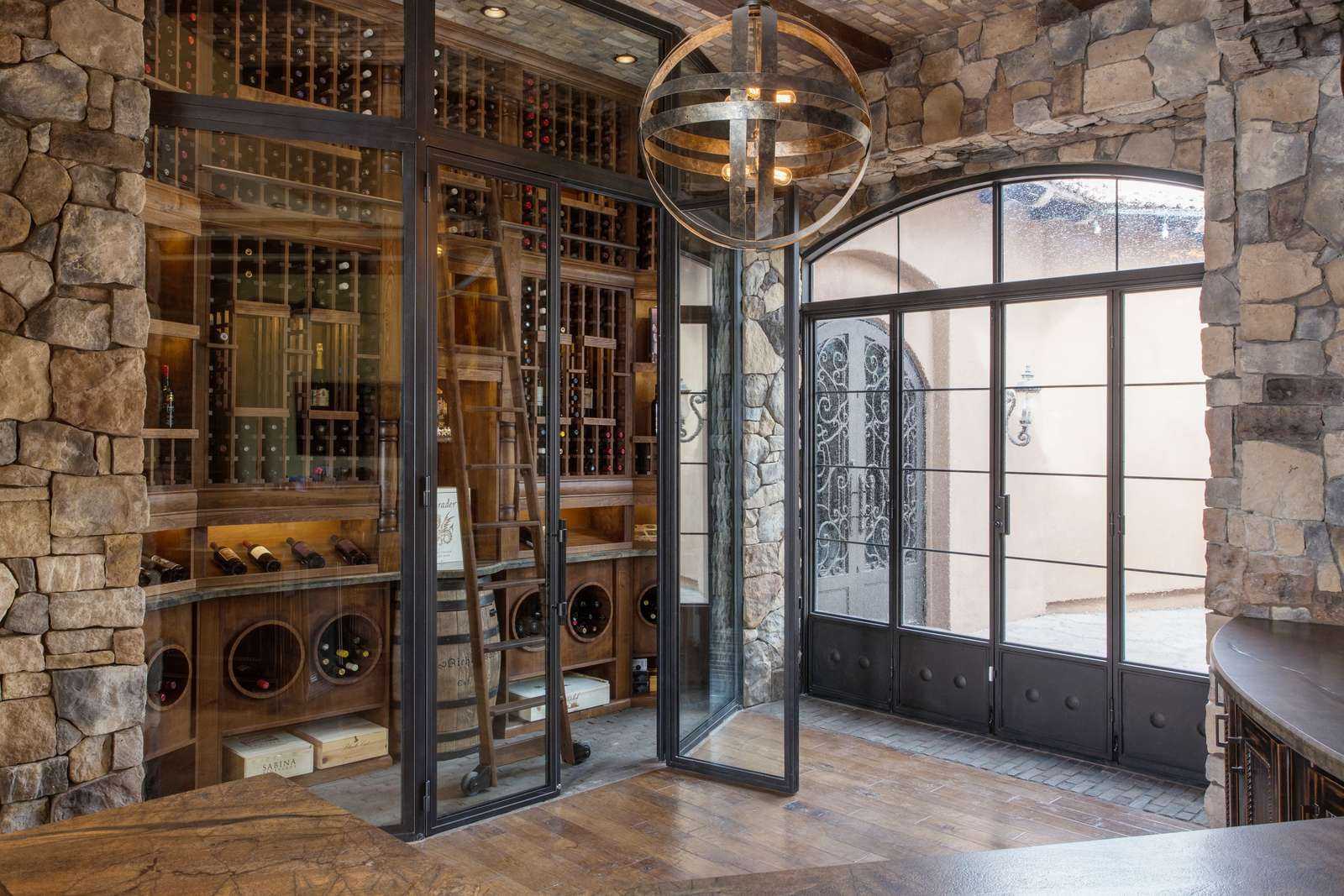 Traditional wooden wine cellar surrounded by glass enclosure